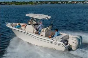 Slide: The Image of 2026 Grady-White Fisherman 257 boat cruising on open water with passengers. - 7