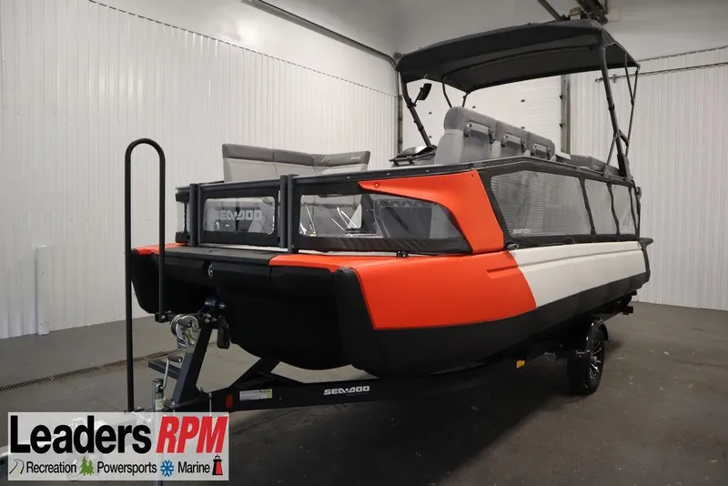 The Image of 2024 Sea-Doo Switch® 21 Sport/Cruise boat, 230 hp, displayed indoors on a trailer. - 1