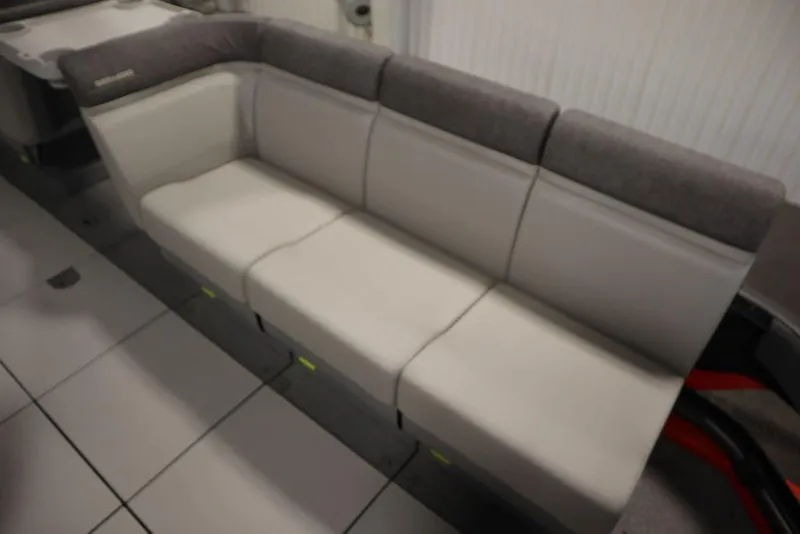 Slide: The Image of 2024 Sea-Doo Switch® 21 Sport/Cruise boat seating, featuring comfortable gray upholstery. - 14