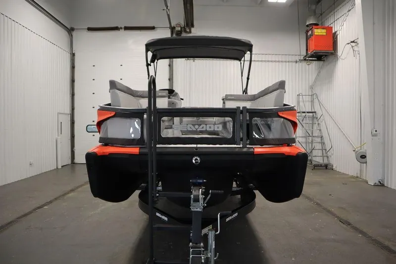 Slide: The Image of 2024 Sea-Doo Switch® 21 Sport/Cruise, 230 hp, in a garage setting, rear view. - 3