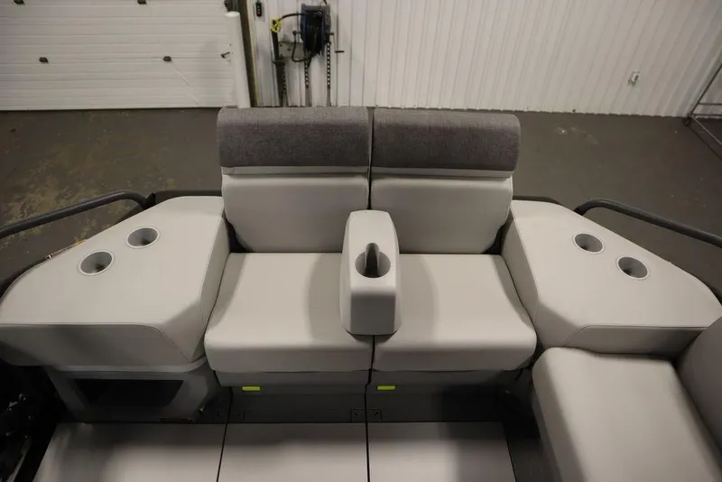 Slide: The Image of 2024 Sea-Doo Switch® 21 Sport/Cruise seating area with cup holders and armrest. - 34