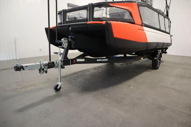 Slide: The Image of 2024 Sea-Doo Switch® 21 Sport/Cruise boat on trailer, featuring vibrant orange and black design. - 40