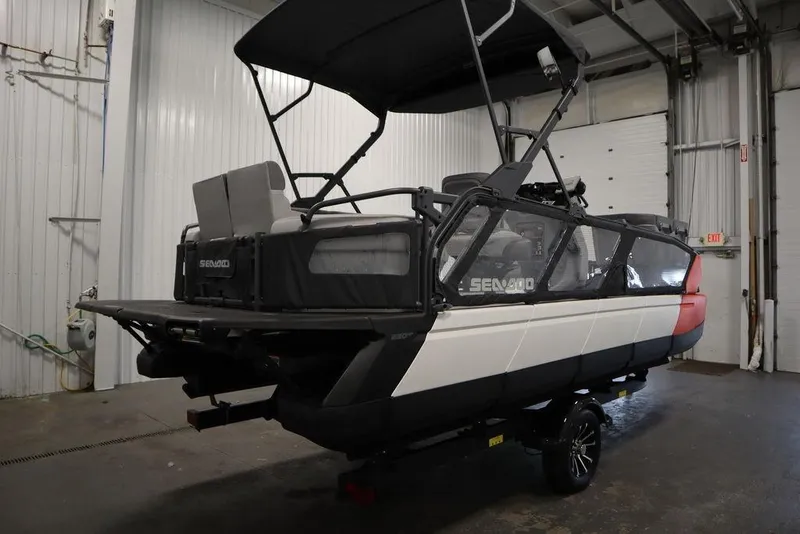 Slide: The Image of 2024 Sea-Doo Switch® 21 Sport/Cruise boat in a garage, showcasing sleek design. - 6