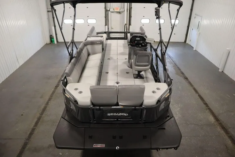 Slide: The Image of 2024 Sea-Doo Switch® 21 Sport/Cruise boat interior with seating and controls. - 9