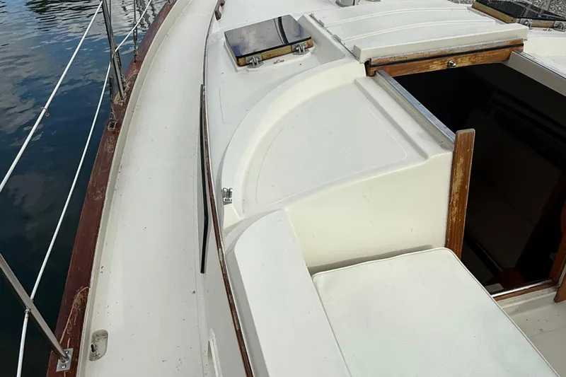 Slide: The Image of 1977 Irwin 37 Mark III sailboat deck with open hatch and railing. - 19
