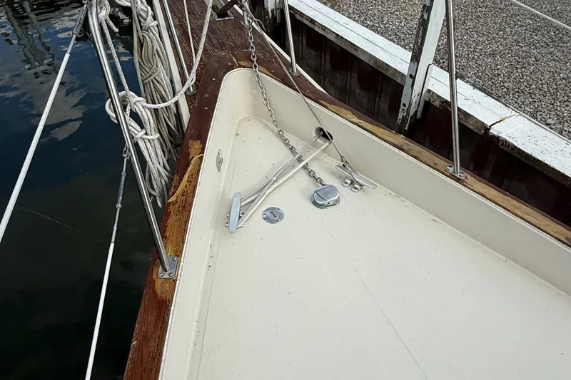 Slide: The Image of 1977 Irwin 37 Mark III sailboat deck with anchor and ropes. - 24