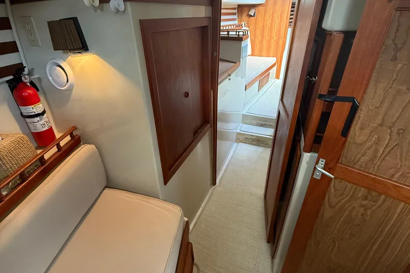 Slide: The Image of Cozy interior of 1977 Irwin 37 Mark III sailboat with wooden accents and seating. - 39