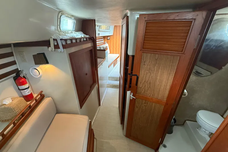Slide: The Image of Interior of 1977 Irwin 37 Mark III sailboat with cozy seating and wooden cabinetry. - 41