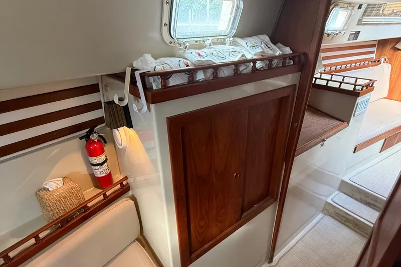 Slide: The Image of Interior of 1977 Irwin 37 Mark III sailboat with wood paneling and cozy seating. - 46