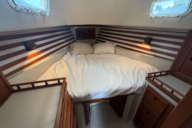 Slide: The Image of Cozy cabin interior of 1977 Irwin 37 Mark III sailboat with double bed and wooden accents. - 51