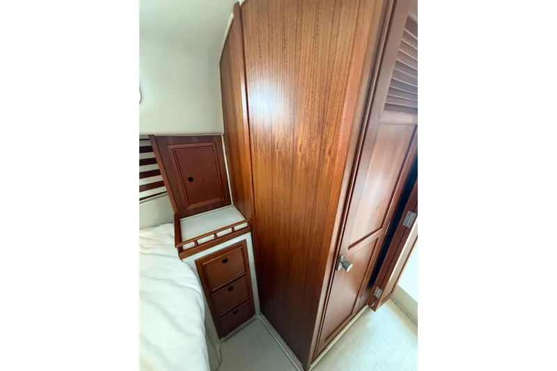 Slide: The Image of 1977 Irwin 37 Mark III interior with wooden cabinetry and storage drawers. - 52