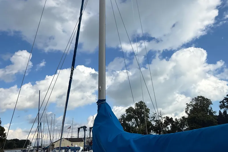 Slide: The Image of Sailboat mast of 1977 Irwin 37 Mark III against a cloudy sky. - 9