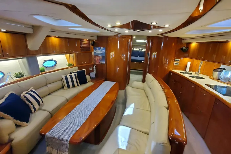 Slide: The Image of Luxurious interior of 1999 Sunseeker Predator 75 yacht with elegant seating and wood finishes. - 6