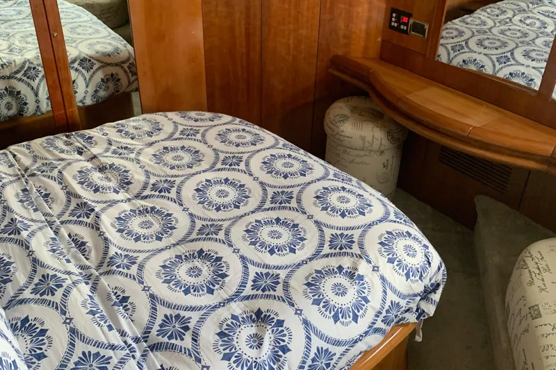 Slide: The Image of Luxurious cabin interior of 1999 Sunseeker Predator 75 yacht with patterned bedding. - 9