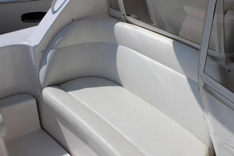 Slide: The Image of 2008 Tiara Yachts 3500 Sovran interior seating with white upholstery. - 14