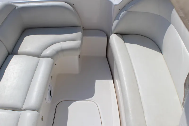 Slide: The Image of 2008 Tiara Yachts 3500 Sovran interior seating with light gray upholstery. - 16