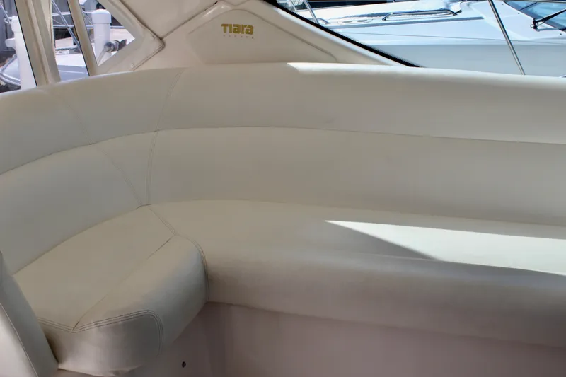 Slide: The Image of 2008 Tiara Yachts 3500 Sovran interior seating with white upholstery. - 17