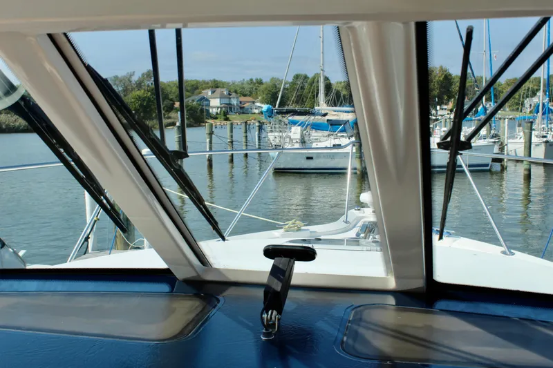 Slide: The Image of 2008 Tiara Yachts 3500 Sovran cockpit view overlooking marina with sailboats. - 30