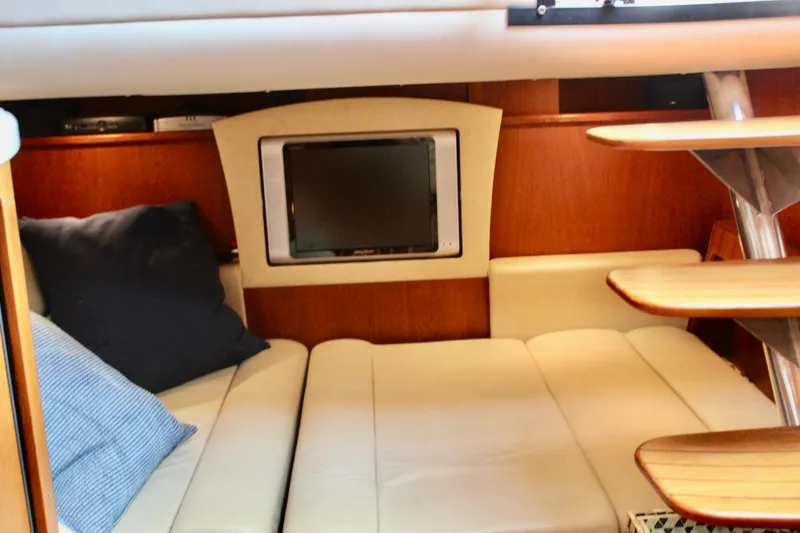 Slide: The Image of 2008 Tiara Yachts 3500 Sovran interior with cozy seating and built-in TV. - 32