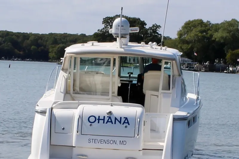 Slide: The Image of 2008 Tiara Yachts 3500 Sovran boat named Ohana on calm water. - 4