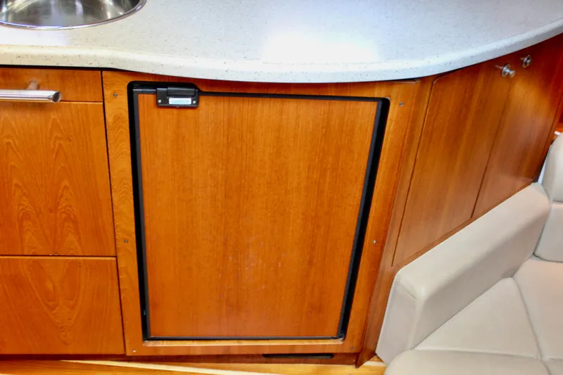 Slide: The Image of 2008 Tiara Yachts 3500 Sovran interior with wooden cabinetry and countertop. - 42