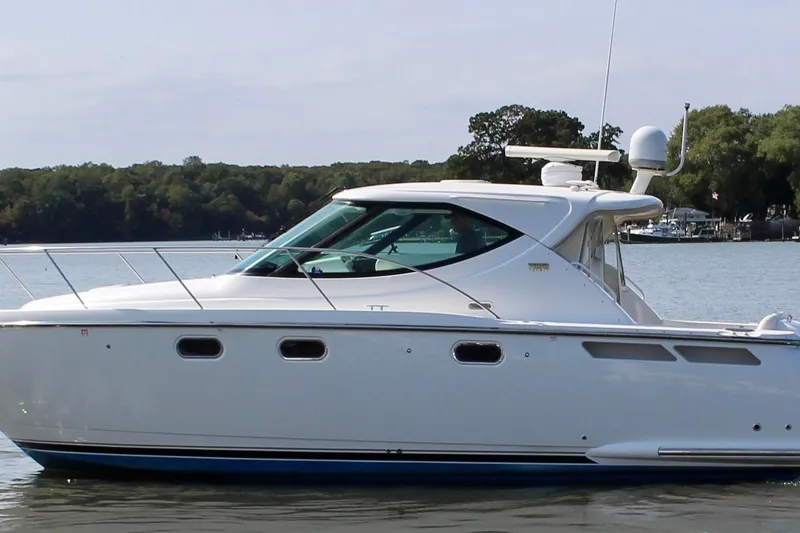 Slide: The Image of 2008 Tiara Yachts 3500 Sovran cruising on calm waters, side view. - 6