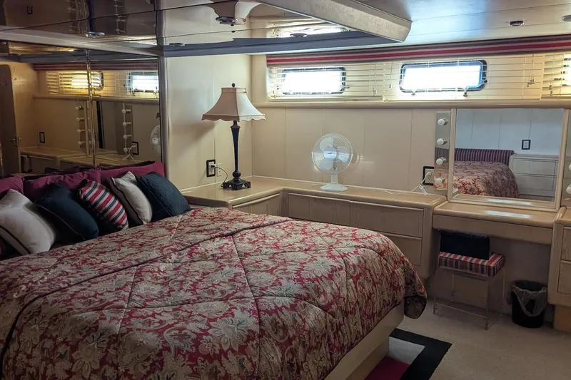 Slide: The Image of Luxurious bedroom interior of 1992 Viking 65 Motor Yacht with elegant decor and cozy bedding. - 11