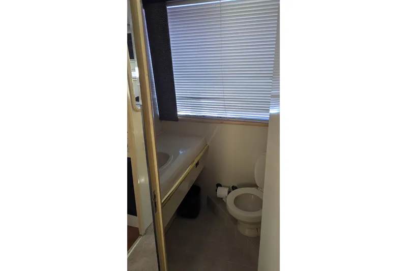 Slide: The Image of Bathroom interior of 1992 Viking 65 Motor Yacht with sink and toilet. - 20