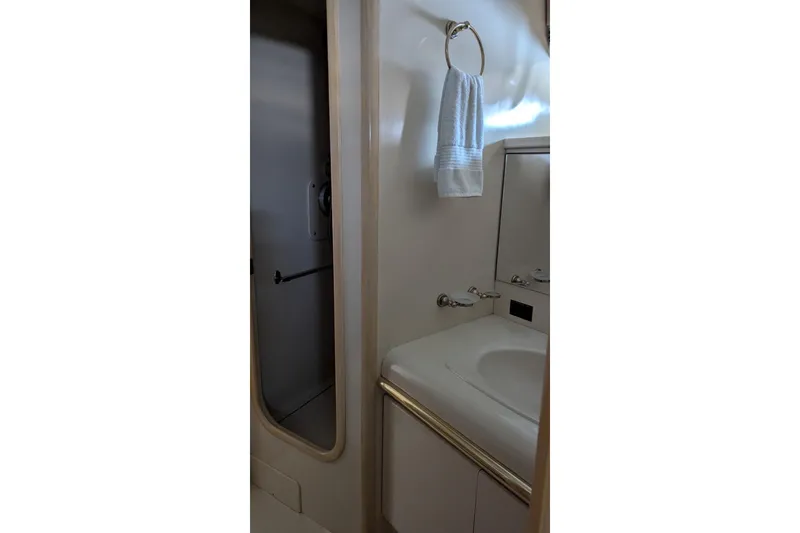 Slide: The Image of Bathroom interior of 1992 Viking 65 Motor Yacht with sink and towel. - 26
