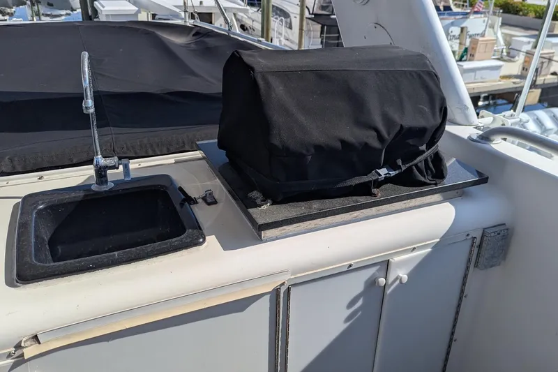 Slide: The Image of Outdoor sink and covered grill on 1992 Viking 65 Motor Yacht deck. - 27