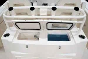 Slide: The Image of 2026 Grady-White Canyon 306 boat interior with storage compartments and cup holders. - 10