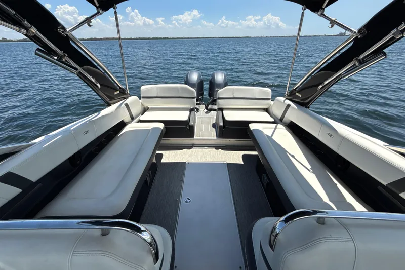 Slide: The Image of 2017 Regal 29 OBX boat interior with spacious seating on open water. - 16