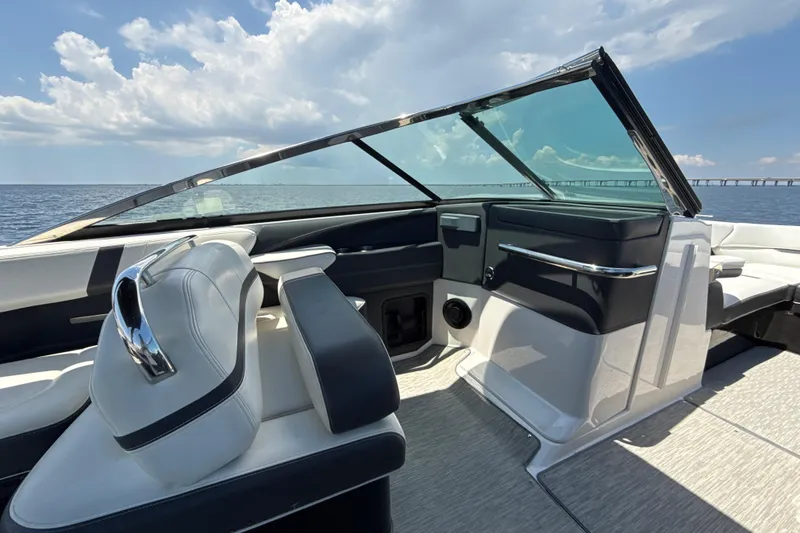 Slide: The Image of 2017 Regal 29 OBX boat interior with sleek seating and ocean view. - 3