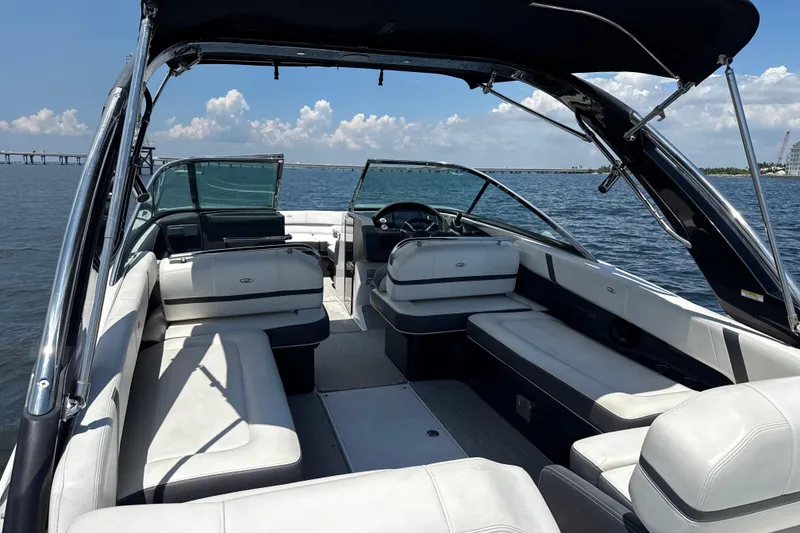 Slide: The Image of 2017 Regal 29 OBX boat interior with spacious seating on open water. - 4