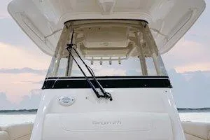 Slide: The Image of 2026 Grady-White Canyon 271 boat interior, featuring rod holders and overhead storage. - 11