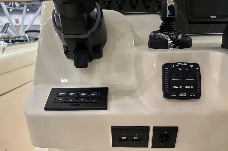 Slide: The Image of 2026 Grady-White Canyon 271 boat dashboard with Yamaha controls and Bennett trim tab. - 15