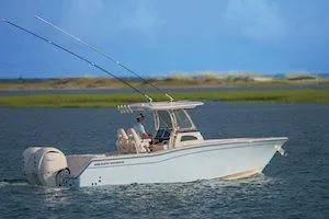 The Image of 2026 Grady-White Canyon 271 boat displayed indoors at a boat show. - 2