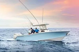 Slide: The Image of 2026 Grady-White Canyon 271 boat with Yamaha engine displayed indoors. - 4