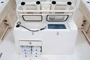 Slide: The Image of 2026 Grady-White Canyon 271 boat interior with dual engines and seating area. - 8