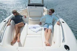 Slide: The Image of 2026 Grady-White Canyon 271 boat interior with dual helm seats and control panel. - 9