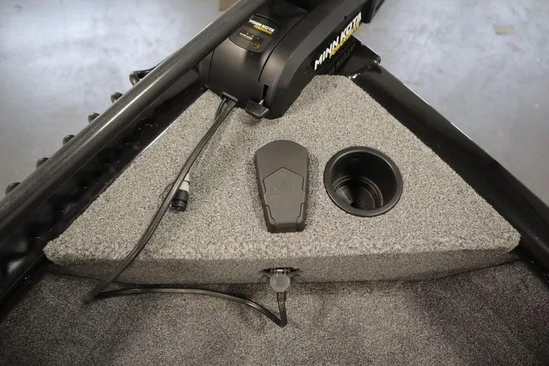 Slide: The Image of 2023 Tracker Pro Guide V-16 WT boat interior with Minn Kota trolling motor. - 16