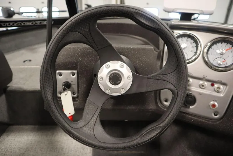 Slide: The Image of Steering wheel and dashboard of 2023 Tracker Pro Guide V-16 WT boat. - 18