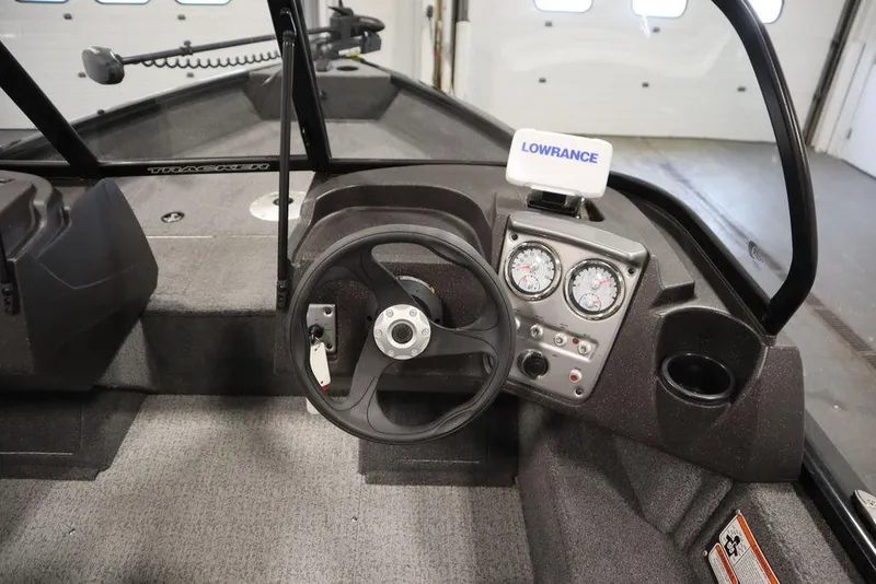 Slide: The Image of 2023 Tracker Pro Guide V-16 WT boat dashboard with steering wheel and Lowrance device. - 20
