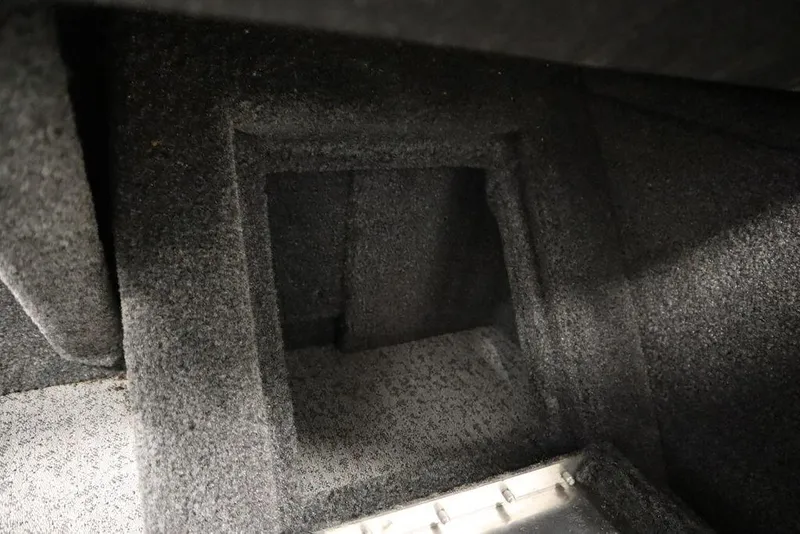 Slide: The Image of Carpeted storage compartment in 2023 Tracker Pro Guide V-16 WT boat. - 27