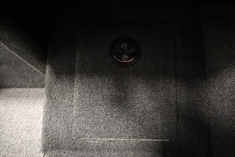 Slide: The Image of 2023 Tracker Pro Guide V-16 WT boat interior with carpeted flooring detail. - 28