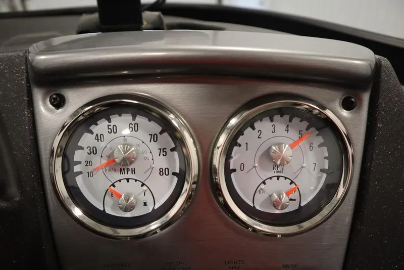 Slide: The Image of 2023 Tracker Pro Guide V-16 WT dashboard with speedometer and tachometer gauges. - 30