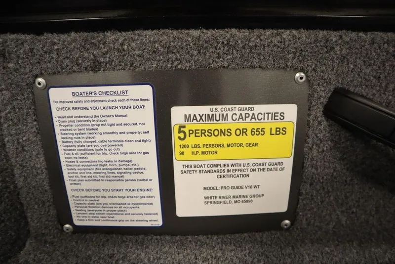 Slide: The Image of 2023 Tracker Pro Guide V-16 WT capacity plate, showing maximum 5 persons or 655 lbs. - 33