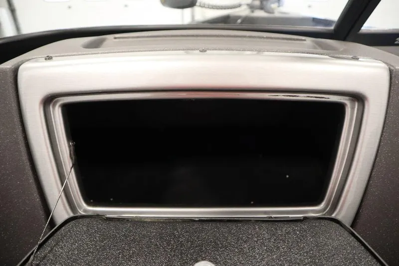 Slide: The Image of 2023 Tracker Pro Guide V-16 WT dashboard compartment, open and empty. - 34
