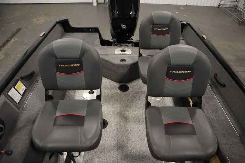Slide: The Image of 2023 Tracker Pro Guide V-16 WT boat interior with four gray seats. - 38