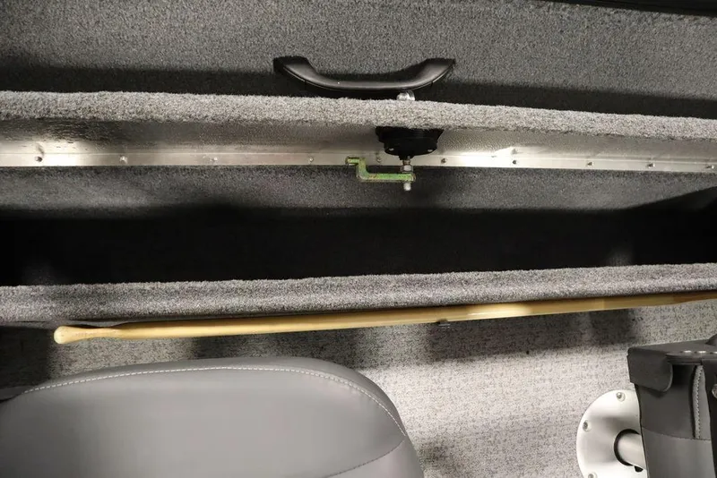 Slide: The Image of 2023 Tracker Pro Guide V-16 WT interior storage compartment with handle and seat detail. - 42